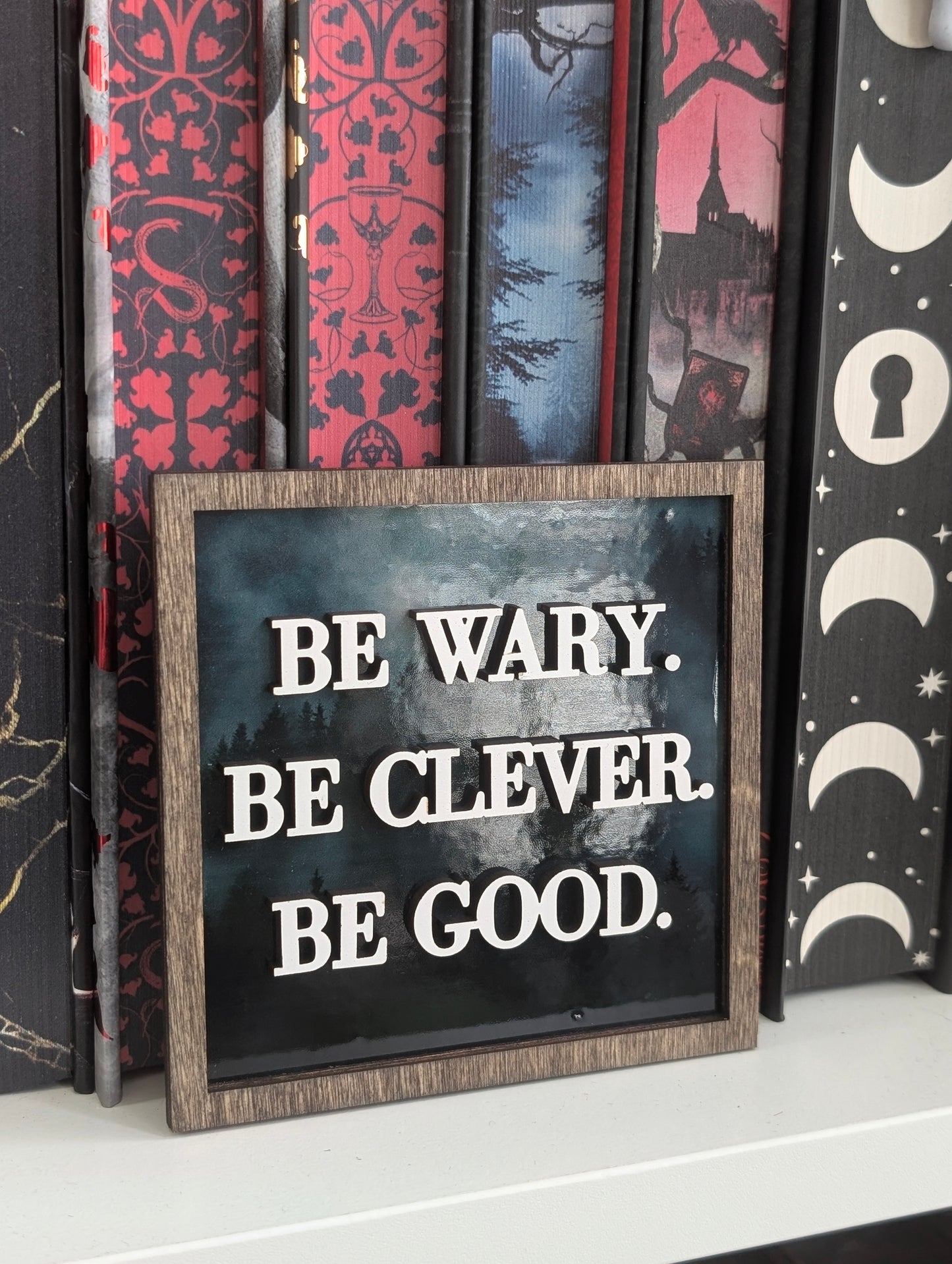 Be Wary. Be Clever. Be Good. One Dark Window Illustrated Bookshelf Sign